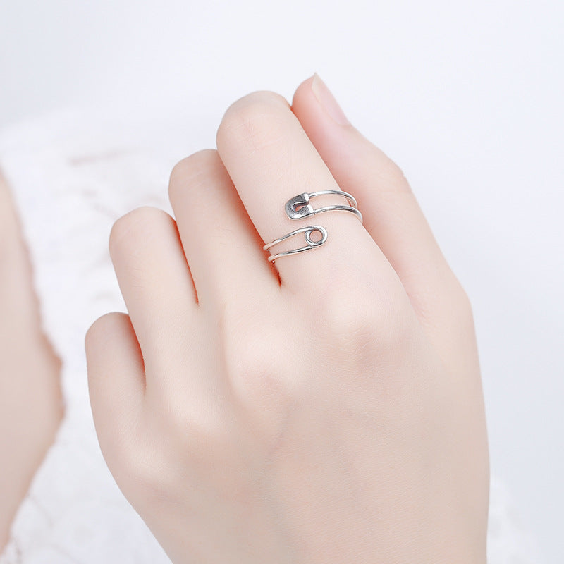 Origsoul modern silver statement ring styled as an open design on a hand with pale skin