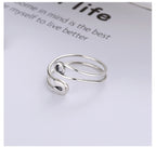 Origsoul modern silver statement ring with unique open spiral design on white background