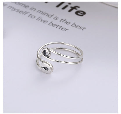 Origsoul modern silver statement ring with unique open spiral design on white background