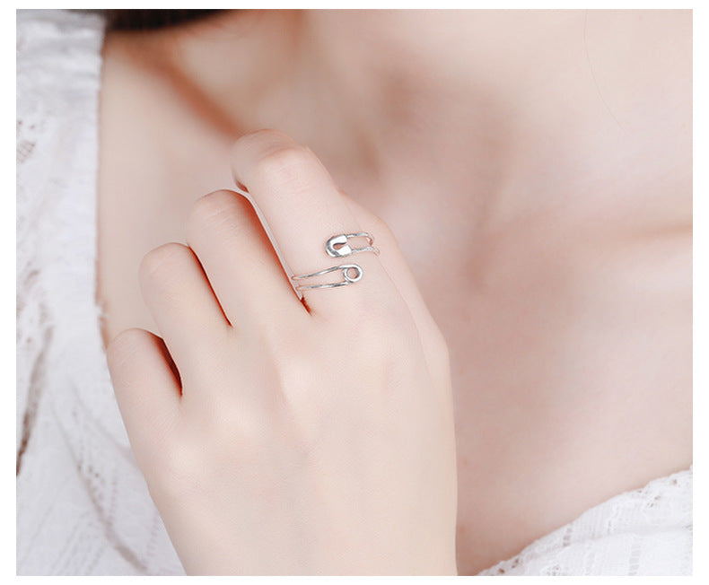 Origsoul modern silver statement ring worn on finger with minimalist open design