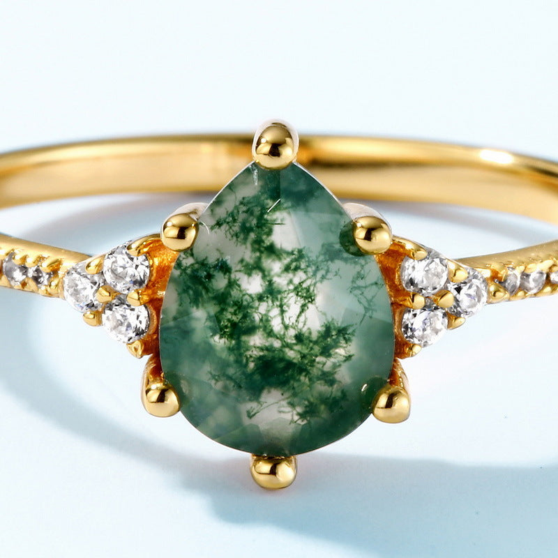 Origsoul gold moss agate ring featuring a pear-shaped green moss agate stone with diamond accents