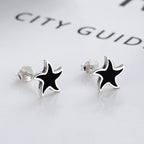 Origsoul nautical star stud earrings with black and silver cosmic jewelry design
