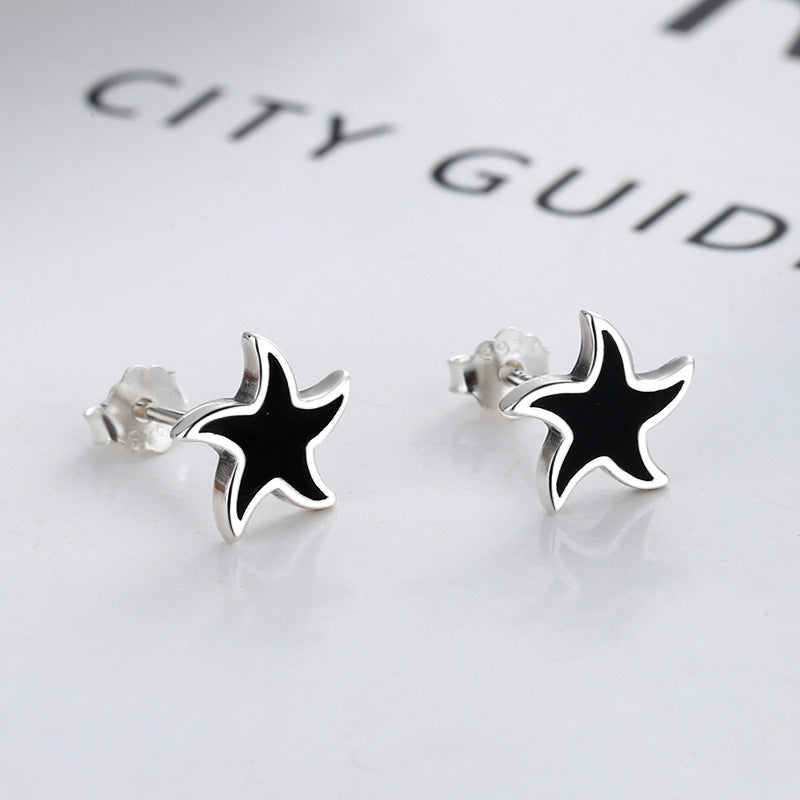 Origsoul nautical star stud earrings with black and silver cosmic jewelry design