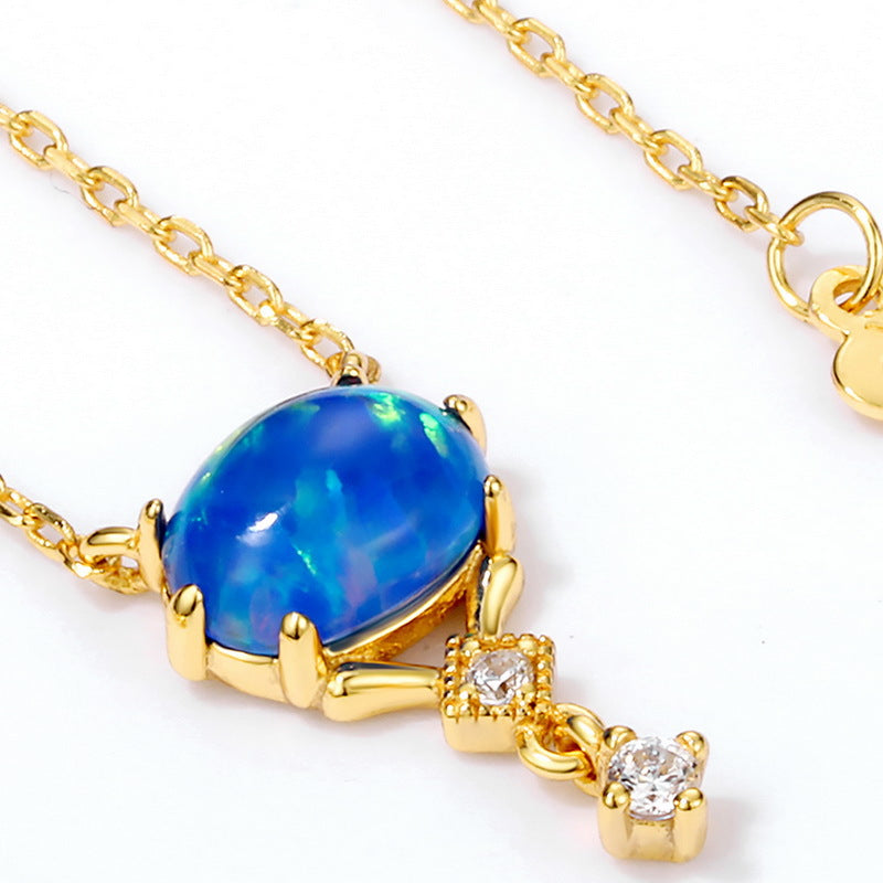 Origsoul opal necklace birthstone featuring a blue opal gemstone with gold chain and diamond accents
