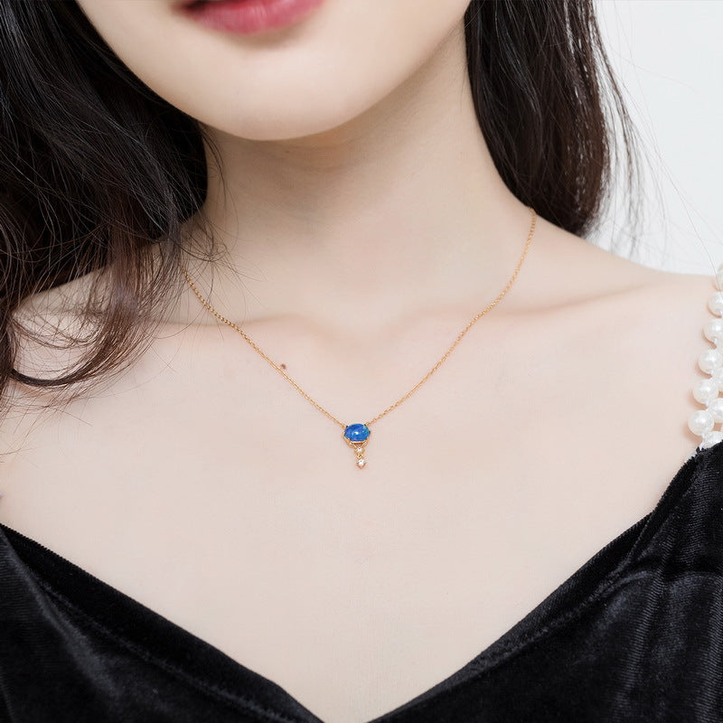 Origsoul delicate opal necklace birthstone with a blue opal pendant on a gold chain