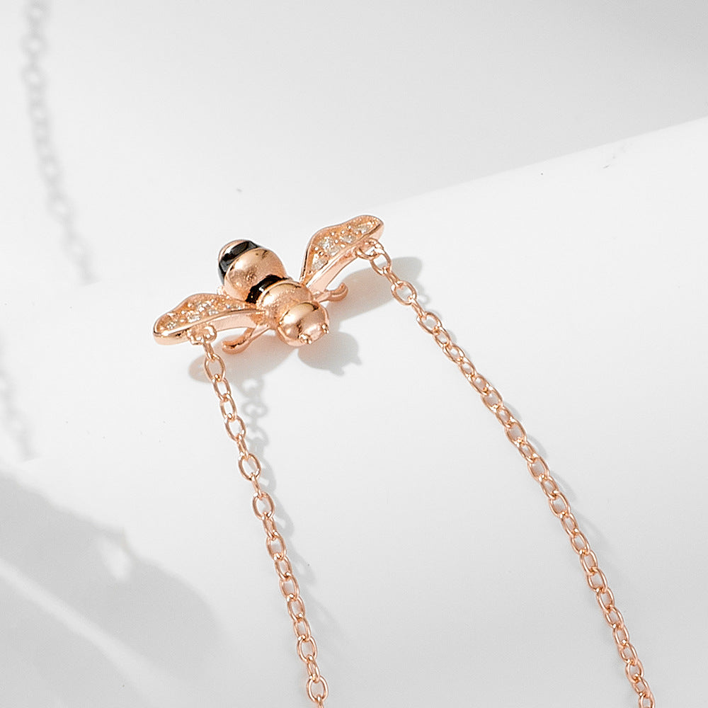 Origsoul insect jewelry featuring a gold bee pendant on a delicate chain painted oil drop jewelry