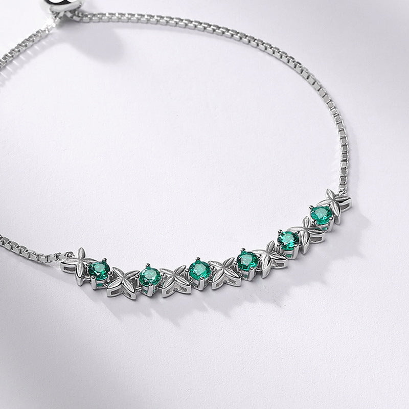 Origsoul sterling silver pandora bracelet with green gemstone and butterfly design accents