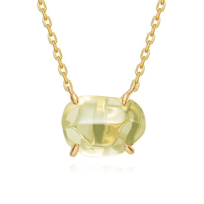 Origsoul pendant in sterling silver with a light yellow gemstone on gold chain necklace