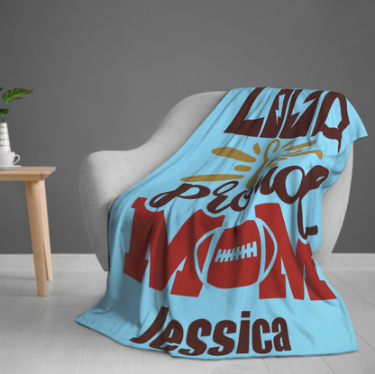 Origsoul personalized 280g cozy throw blanket in blue with custom text draped over gray chair
