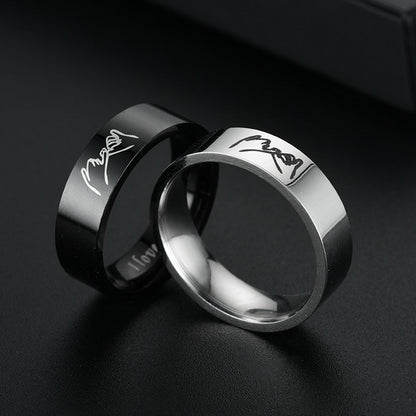 Origsoul personalized couples ring set with black and silver bands featuring engraved signatures