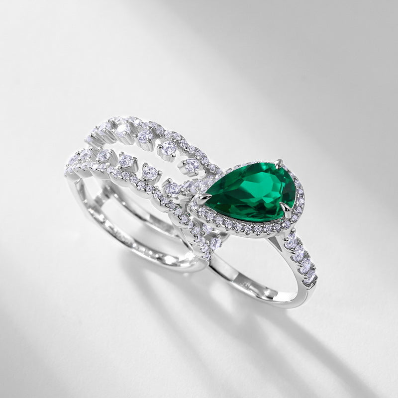 Origsoul engagement ring emerald cut with pear-shaped green gemstone and diamond accents