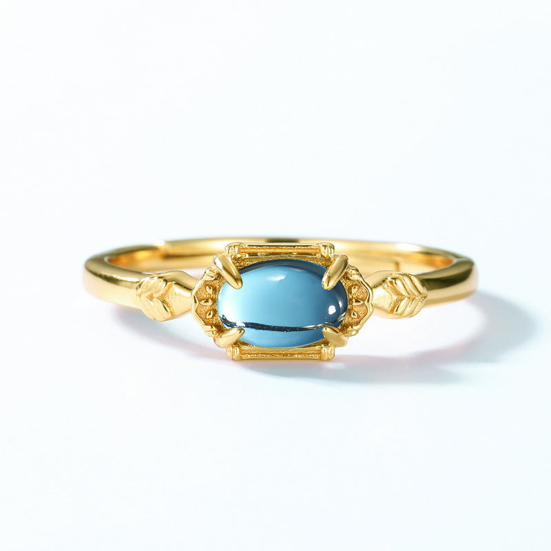 Gold ring with blue oval stone featuring intricate detailing by Origsoul ring sterling silver