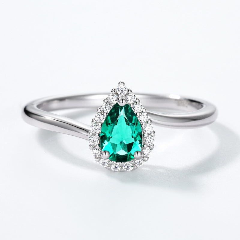Origsoul ring sterling silver with pear-shaped green gemstone surrounded by small clear crystals