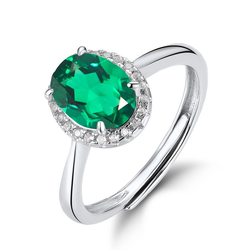 Origsoul ring sterling silver with oval green gemstone and small clear stones surrounding it