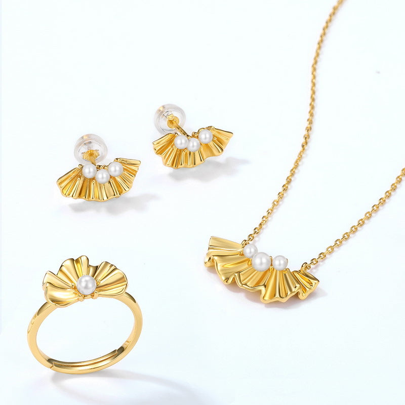Origsoul ring sterling silver with gold finish and pearl detail alongside matching earrings and necklace