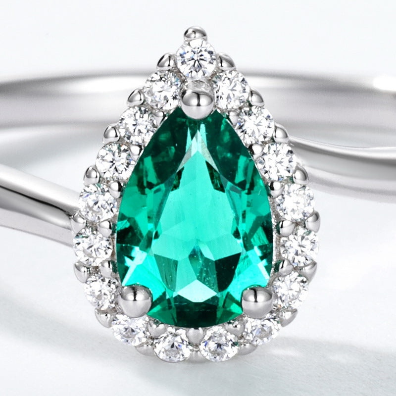 Origsoul ring sterling silver with pear-shaped green gemstone and surrounding clear crystals