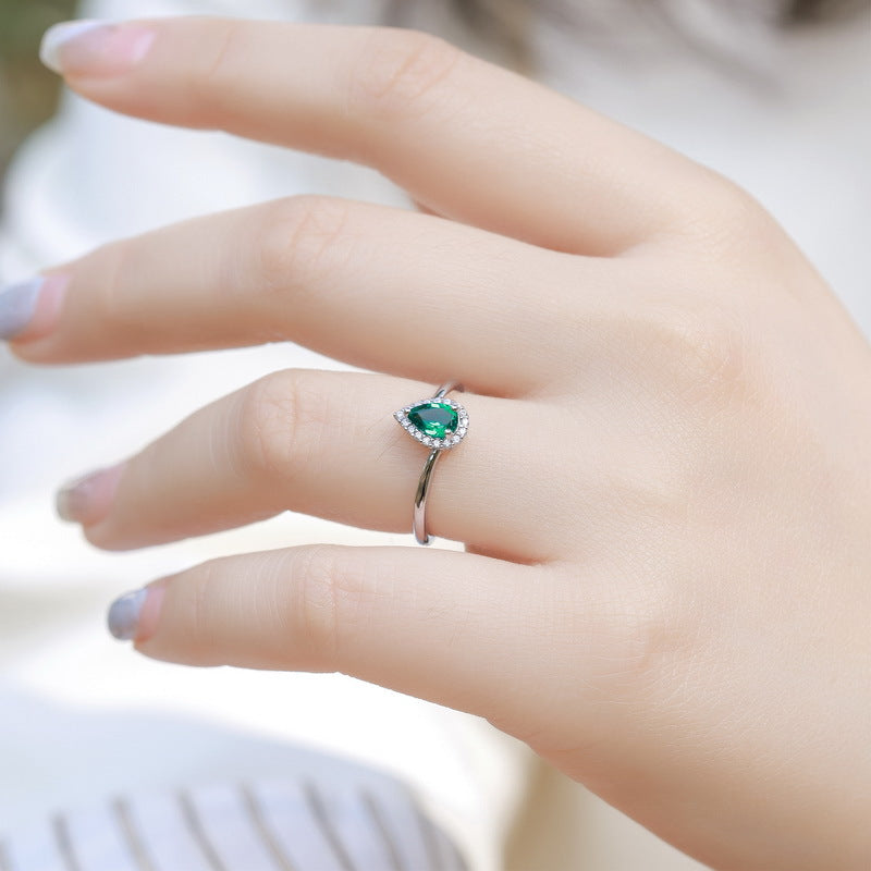 Origsoul ring sterling silver featuring pear-shaped green gemstone surrounded by small clear stones