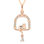 Origsoul rose gold cat necklace with floral and star accents and a dangling teardrop gem