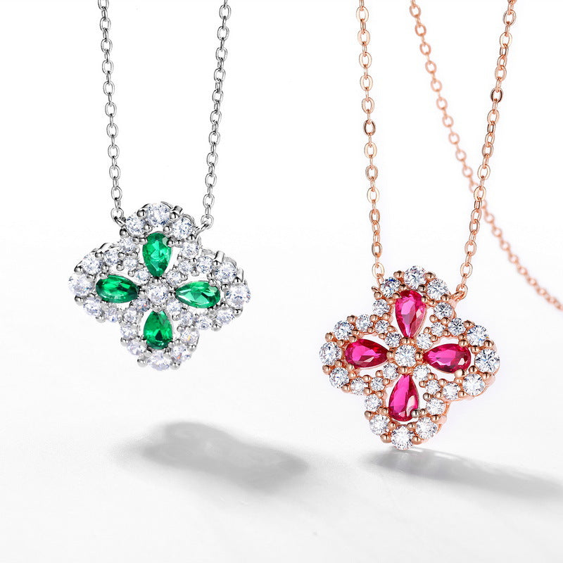 Origsoul ruby necklace with pear-shaped red gemstones and sparkling clear crystals on rose gold chain