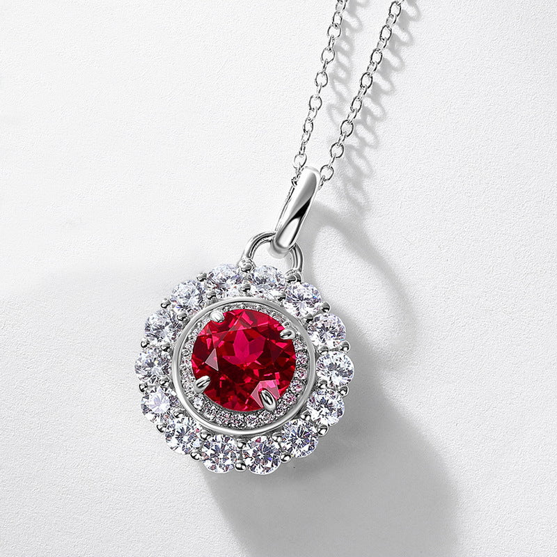 Origsoul jewelry pendant with red gemstone surrounded by clear crystals on silver chain emerald necklace