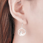 Origsoul S925 fox pendant earrings in silver displayed on a model's ear for a stylish look