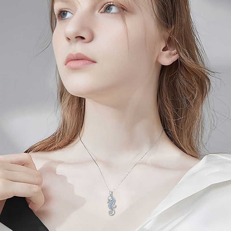 Elegant woman wearing an S925 seahorse pendant necklace that adds a touch of charm