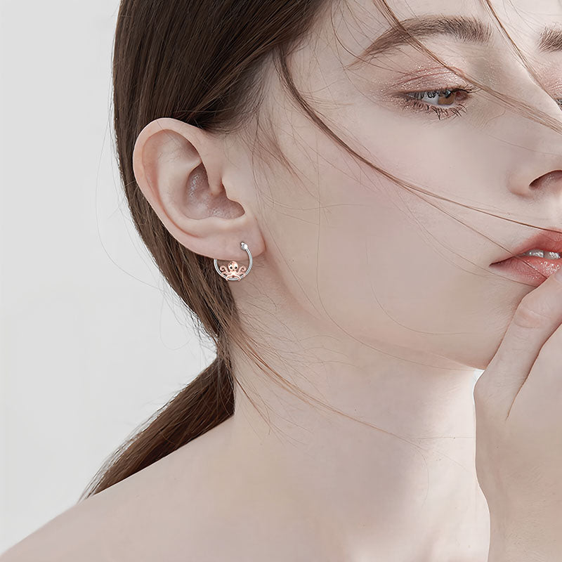 Origsoul S925 sterling silver marine life earrings on a model showcasing elegant design