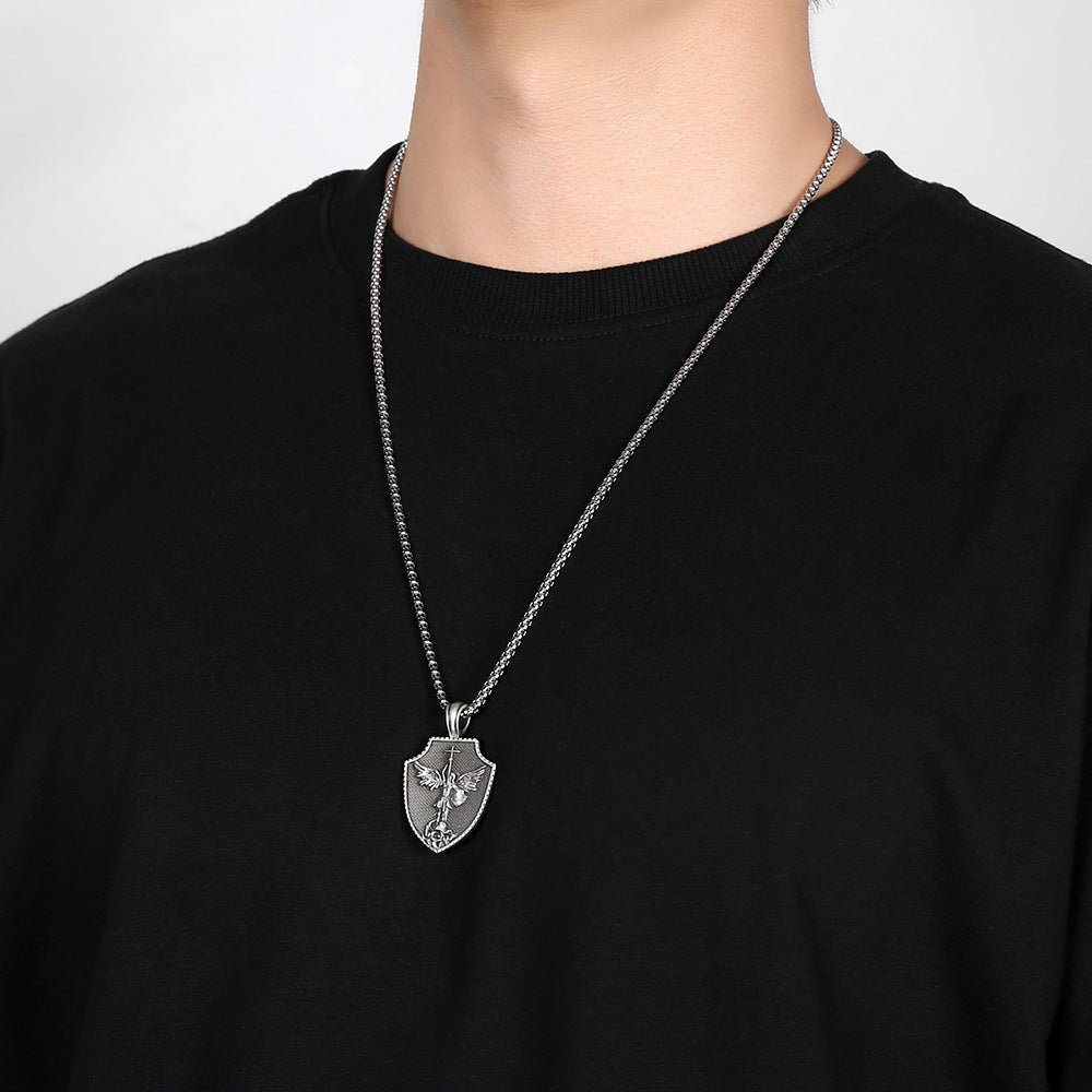 Saint michael pendant for men from Origsoul Tranquil Spirit Collection worn with a silver chain on black shirt