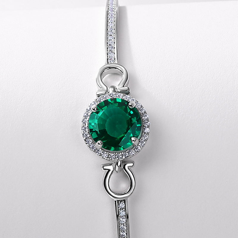 Origsoul elegant silver bracelet with emerald centerpiece and surrounding small clear stones