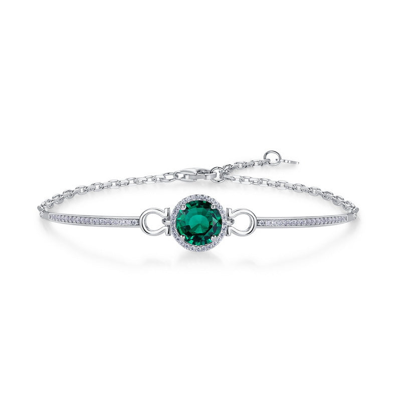 Origsoul delicate silver bracelet with emerald centerpiece and small crystal accents