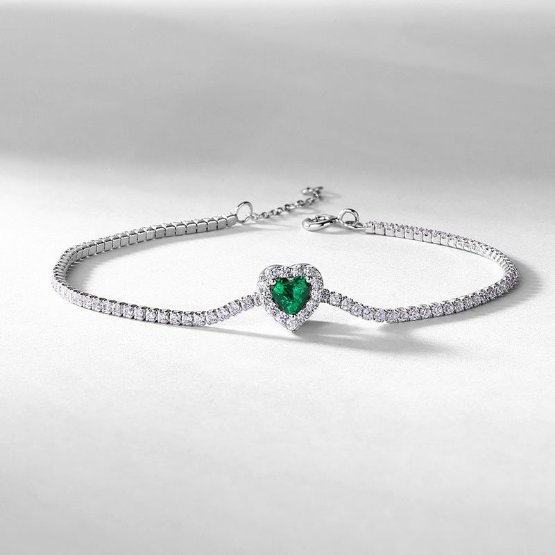 Origsoul elegant bracelet with emerald heart-shaped centerpiece and silver diamond accents