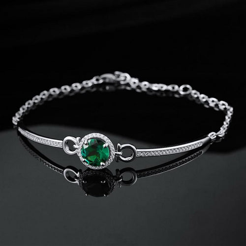 Origsoul elegant bracelet with emerald center stone and silver chain on black background