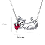 Origsoul silver cat necklace with a playful cat holding a red heart pendant on a delicate chain