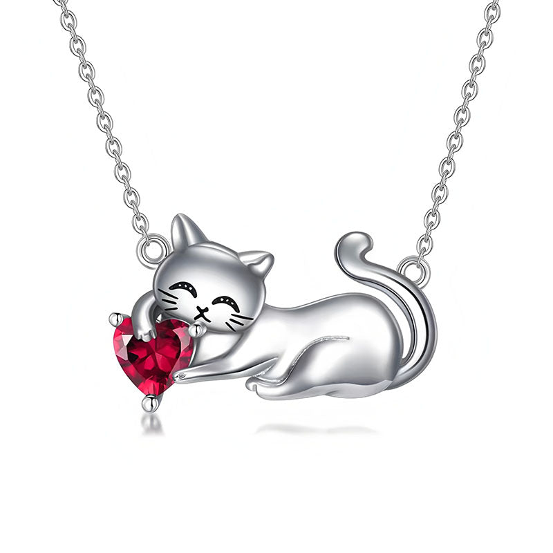 Origsoul silver cat necklace featuring a playful cat holding a red heart-shaped gemstone pendant