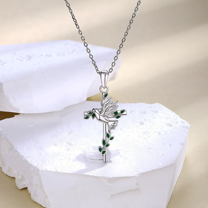 Origsoul dove and cross pendant necklace with silver chain and green leaf details