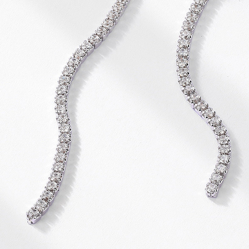 Origsoul silver earrings sterling long curved design with sparkling stones on white background