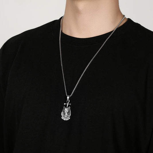 Origsoul Egyptian cat necklace in silver worn on a chain over a black shirt