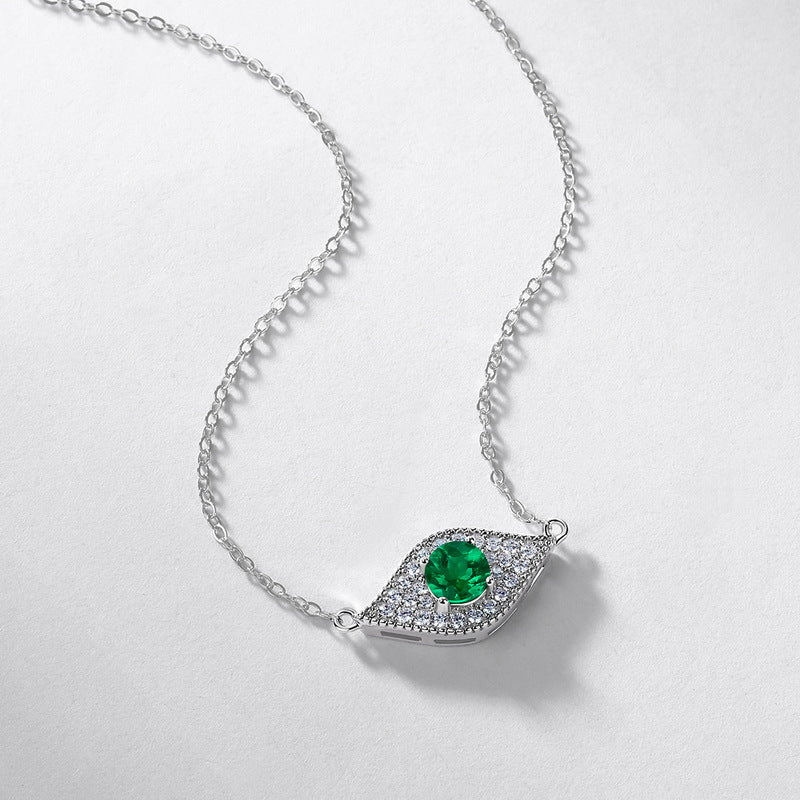 Origsoul emerald necklace with silver chain and green gemstone pendant surrounded by clear crystals