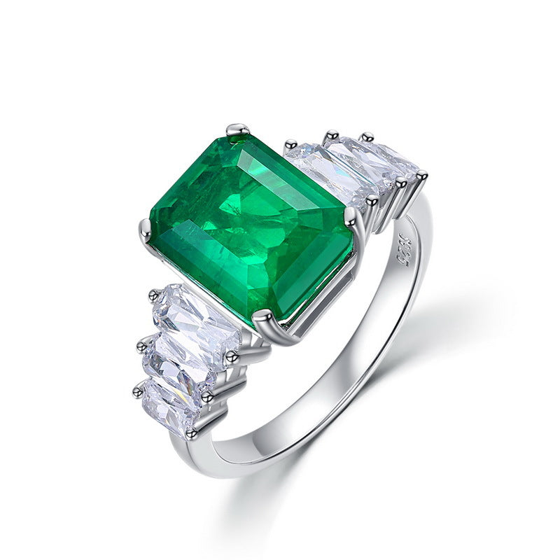 Origsoul engagement ring emerald cut with large green emerald center stone and side white gemstones