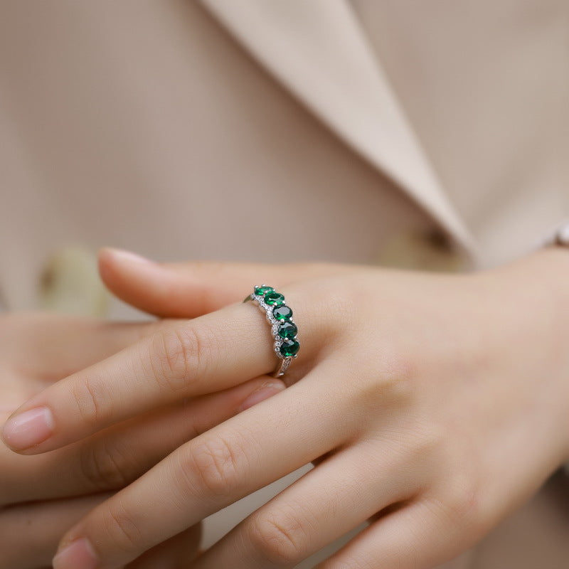 Origsoul engagement ring emerald cut with green gemstones worn on hand