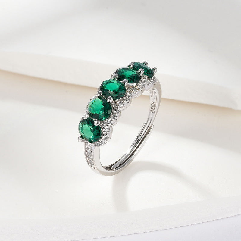 Origsoul engagement ring emerald cut with five green gemstones set in silver band