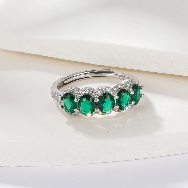 Origsoul engagement ring emerald cut design with multiple green emerald stones and silver band