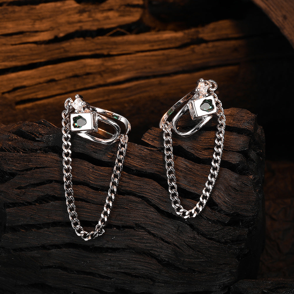 Origsoul geometric chain drop earrings in silver with square and chain design on dark wood background
