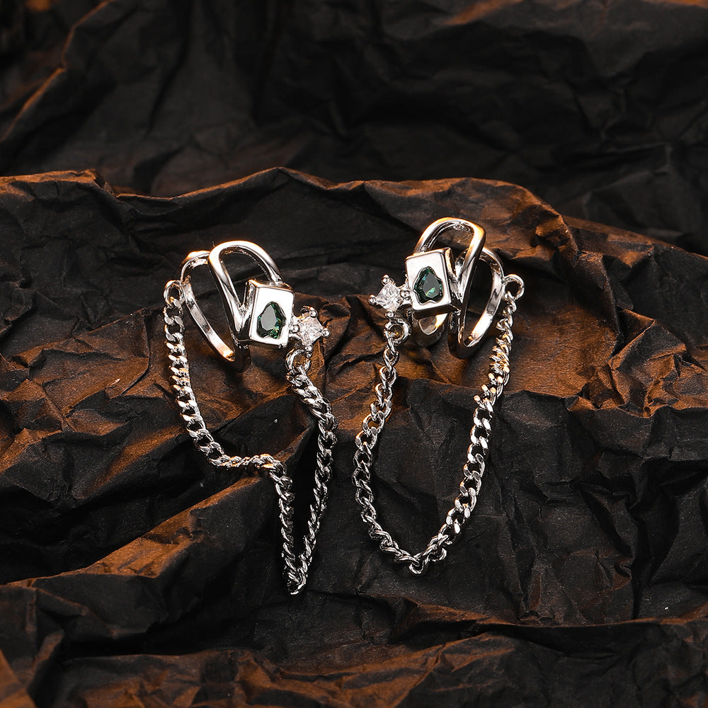 Origsoul geometric chain drop earrings with silver chains and gemstone accents on black background