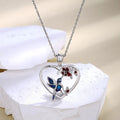 Origsoul hummingbird heart pendant necklace with blue hummingbird and red flower accents on silver chain