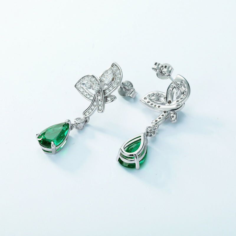 Origsoul silver earrings featuring green lab-grown emerald rings with teardrop design and clear crystal accents