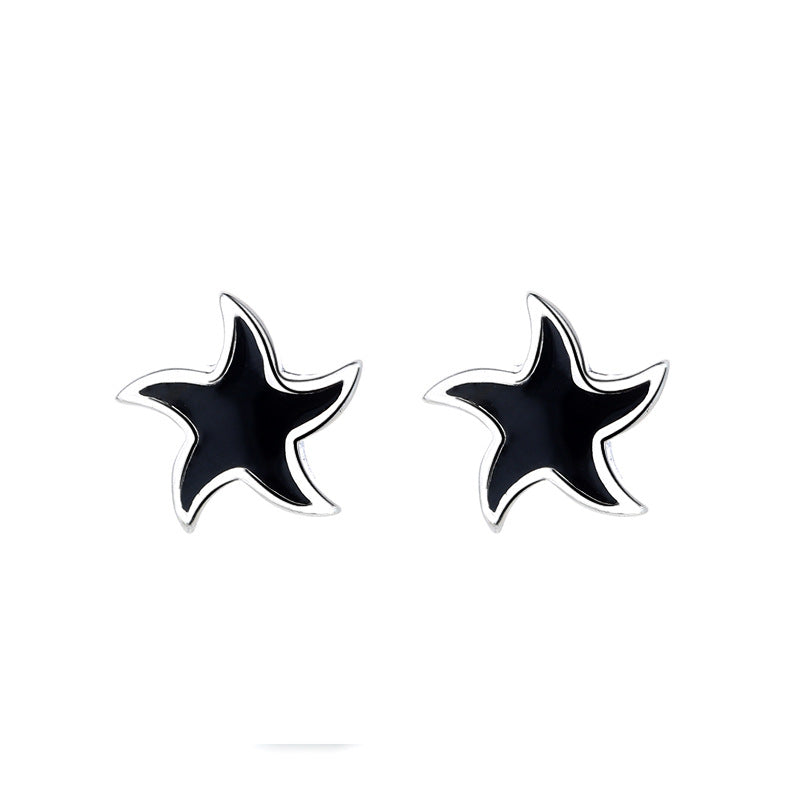 Origsoul nautical star stud earrings in black with silver edges cosmic jewelry design