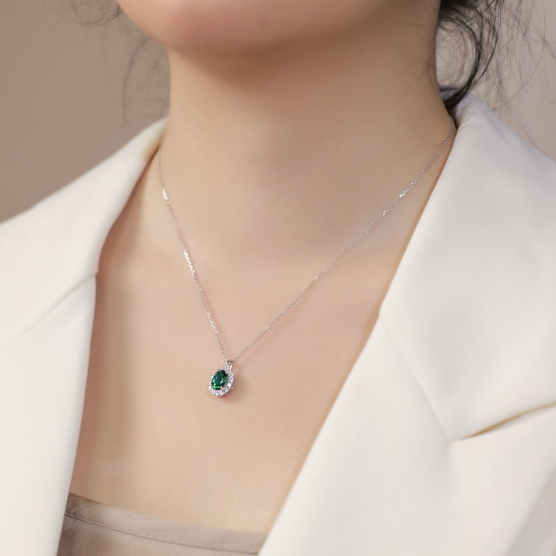 Origsoul silver necklace sterling with green gemstone pendant worn with white blazer