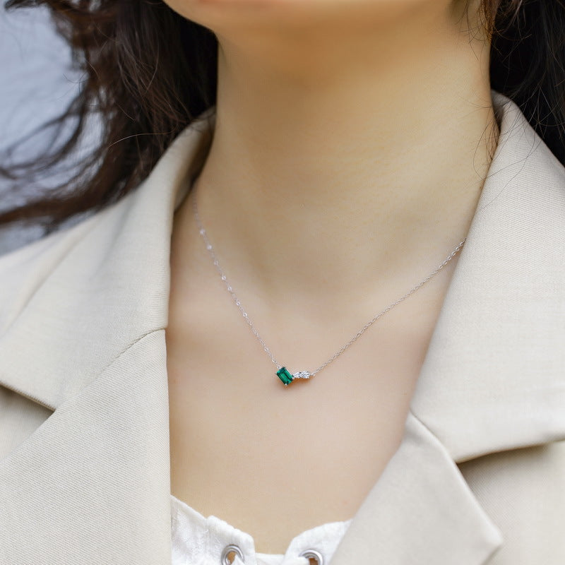 Origsoul silver necklace sterling with small green gemstone pendant worn on model's neck