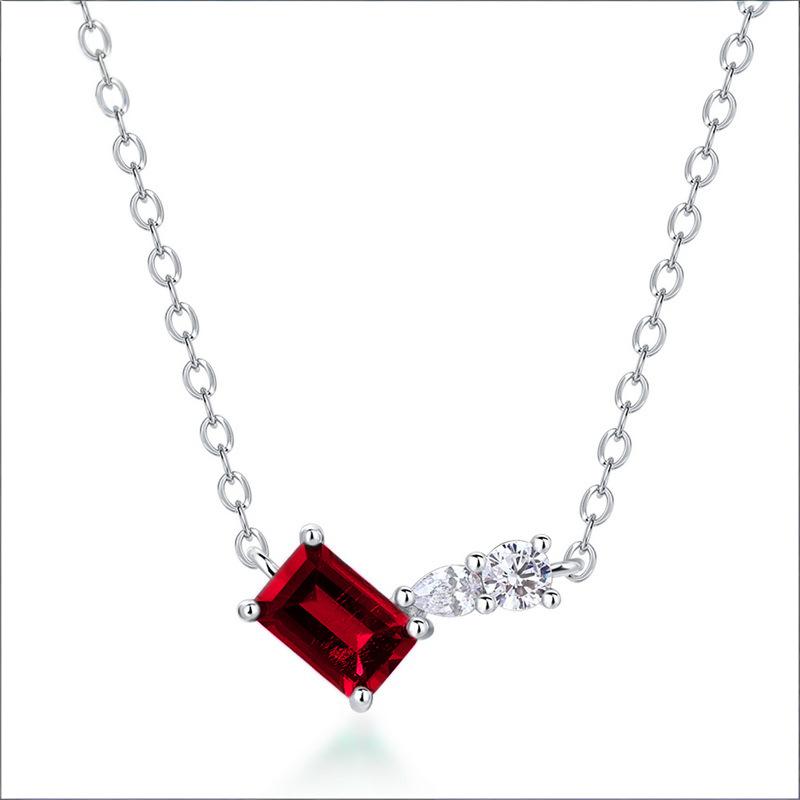 Origsoul silver necklace sterling with a rectangular red gemstone and small clear stones on a delicate chain